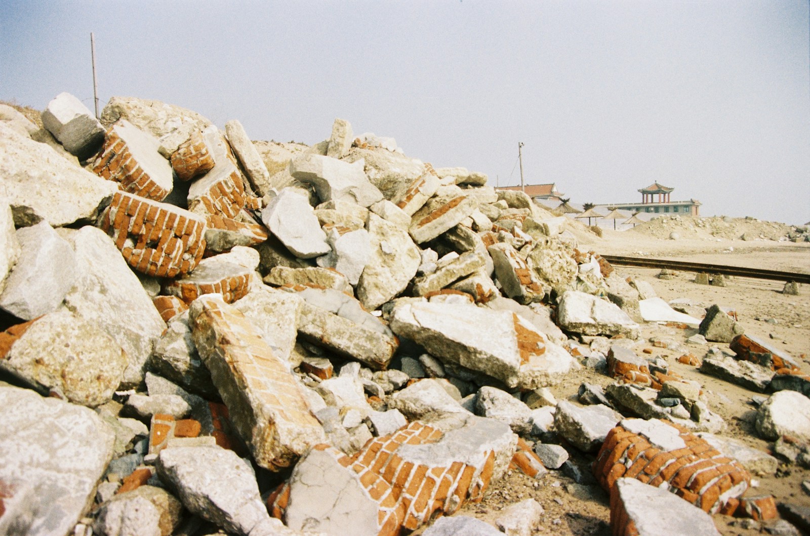 a pile of rocks sitting on top of a beach